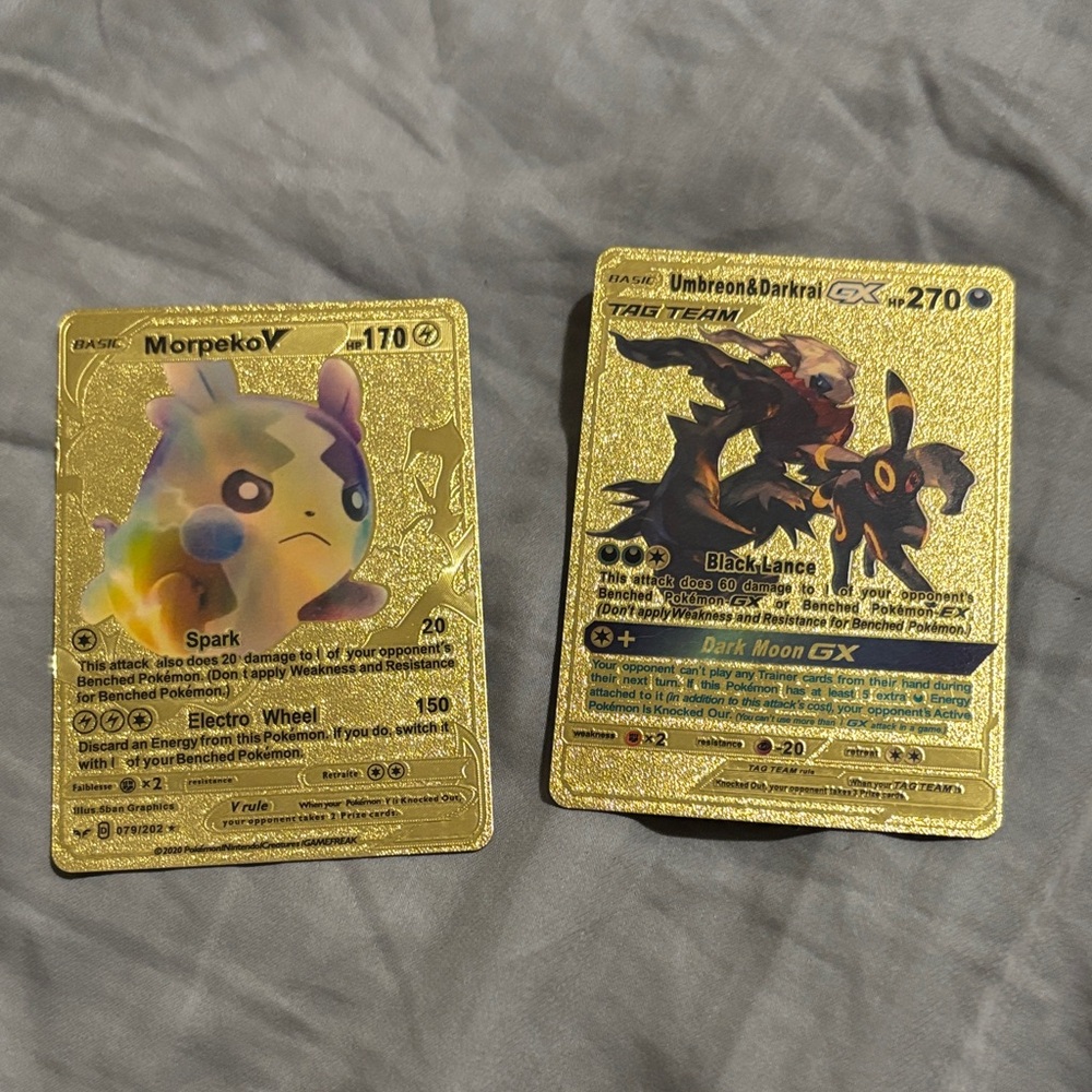 Gold shiny trading cards with these Pokémon listed: Morpeko, Umbreon & Darkrai